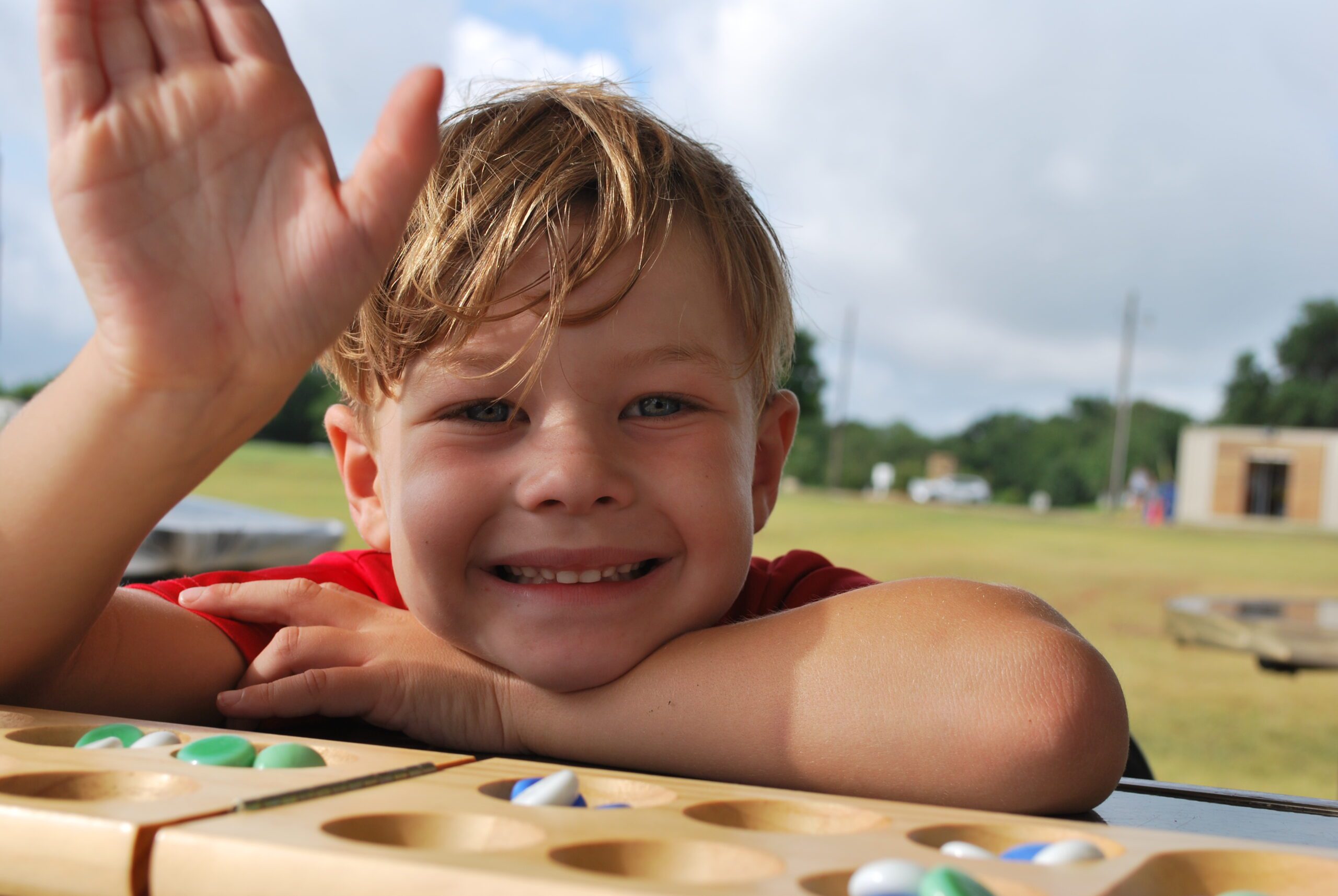 Camper Playing Mancala